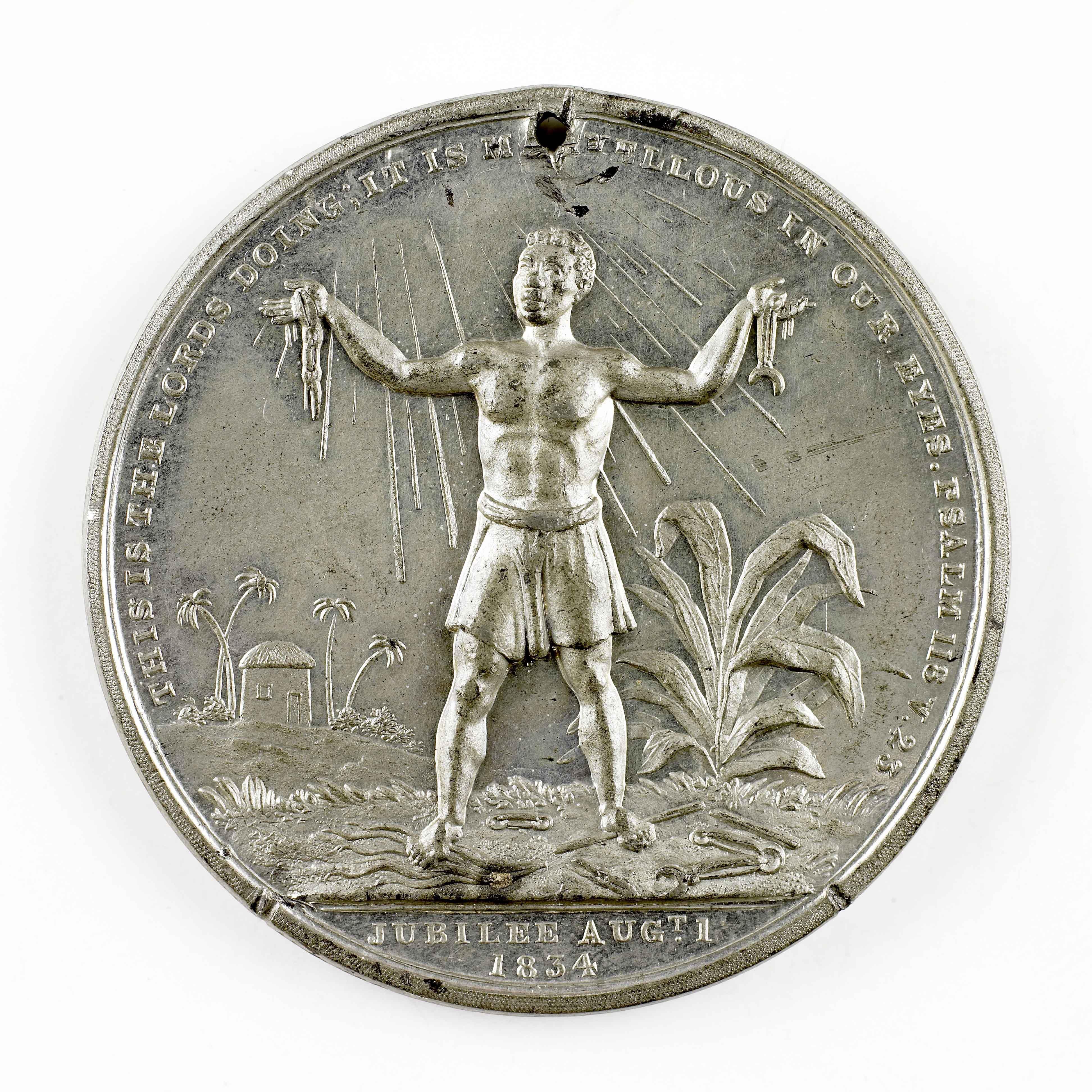 A silver coin with an image of a slave embossed on it