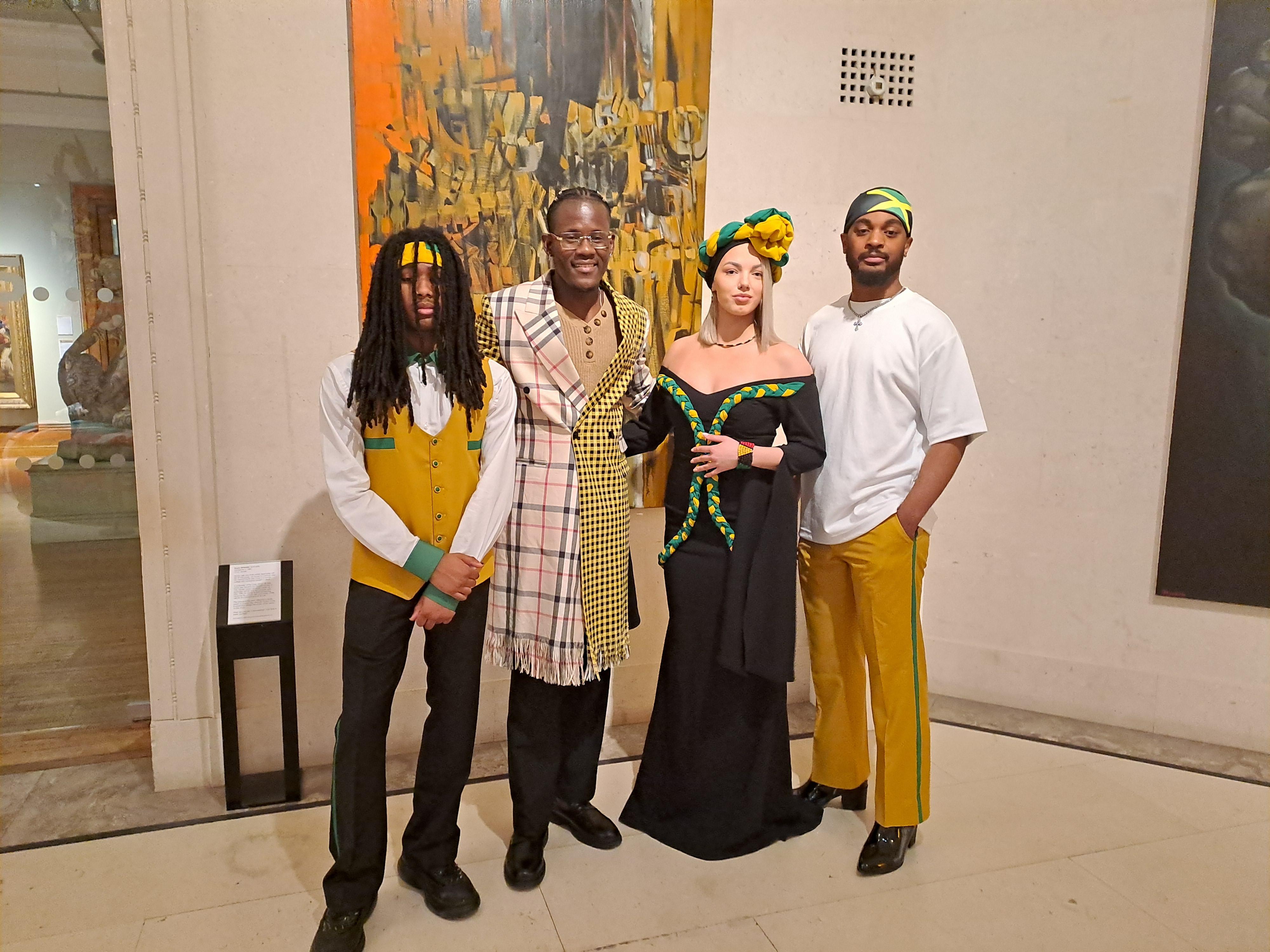 A group of four people stood in front of an artwork