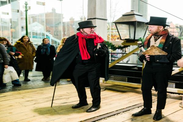 Two people dressed in Victorian clothing