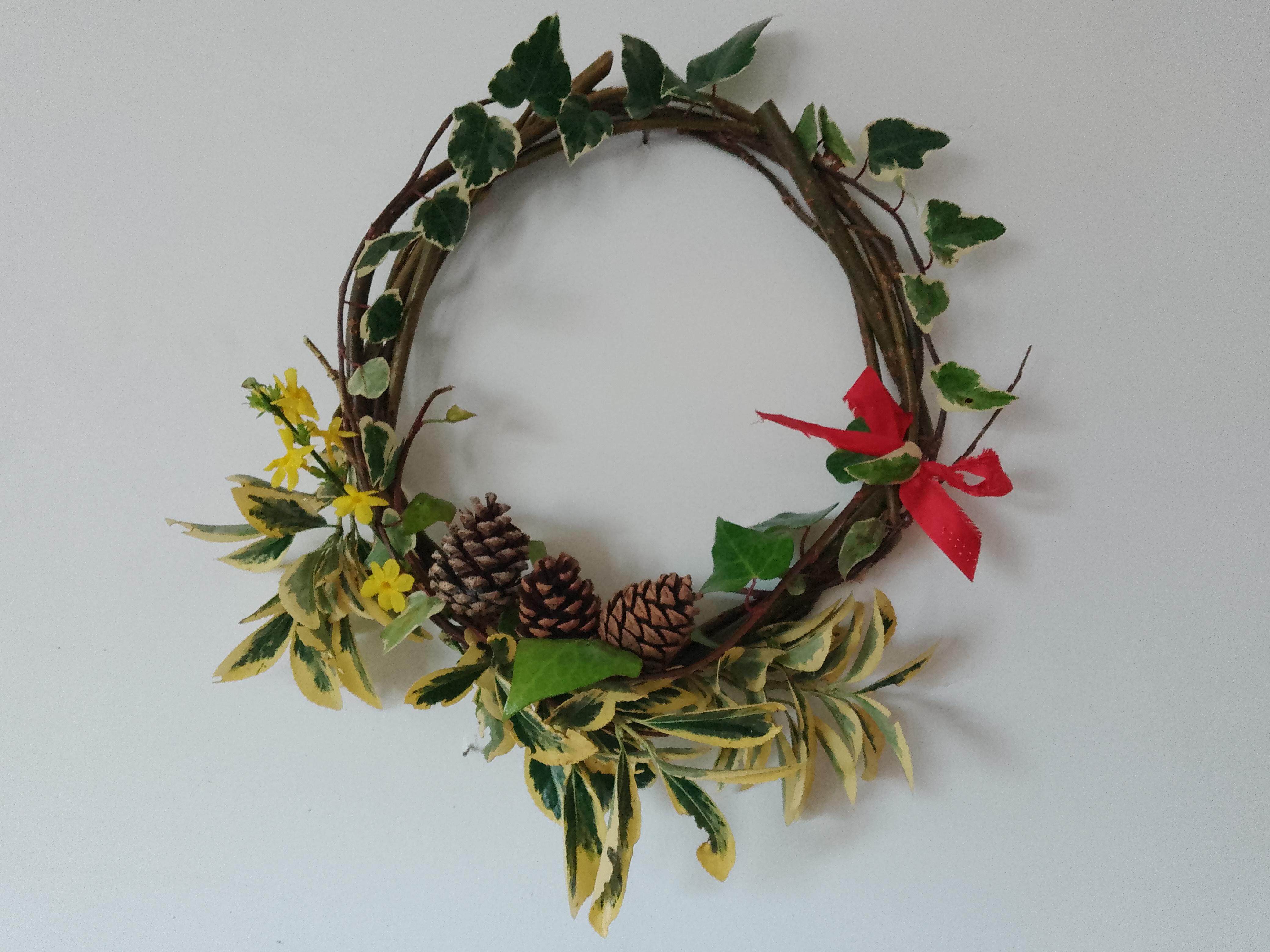 A circular wreath made of twigs and leaves.