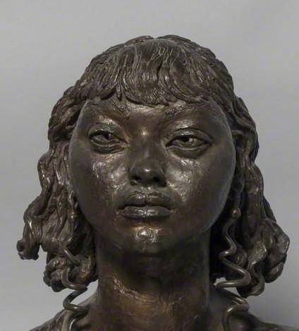 A sculpture of the head of a woman